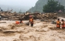 This photo taken and released by Vietnam News Agency (VNA) on July 17, 2026, shows rescue workers addressing the aftermath of flash floods in Muong Than Commune, Lai Chau Province, northern Vietnam. (Photo by Vietnam News Agency (VNA) / AFP)