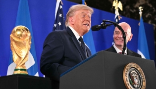 FIFA President Gianni Infantino (R) listens to US President Donald Trump speak during a FIFA reception at Trump Tower in New York on July 17, 2026. President Trump will attend the 2026 World Cup Final between Spain and Argentina. (Photo by Mandel NGAN / AFP)