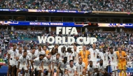 England's players pose for a photo with their medals after winning the 2026 World Cup football tournament third-place match between France and England at the Miami Stadium in Miami on July 18, 2026. (Photo by CHANDAN KHANNA / AFP)