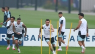 Argentina’s Lionel Messi (centre) exercises during a training session on the eve of the final. 