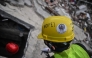 Volunteers and Mexican rescuers search for bodies amid debris of buildings damaged by the June 24 earthquakes, in Tanaguarena, state of La Guaira; Venezuela, on July 18, 2026. (Photo by Juan Barreto / AFP)