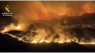 This screen grab taken from handout aerial video footage released on July 18, 2026 by Spain's Pegaso unit of the Guardia Civil shows a massive wildfire, in Cinco Villas area, near Zaragoza, in a sparsely populated part of the Aragon region in northeastern Spain. (Photo by Handout / Spanish Guardia Civil / AFP)