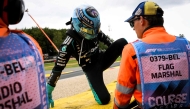 Mercedes' British driver George Russell reacts as he leaves the racing tack after crashing in gravels following a collision with Ferrari's British driver Lewis Hamilton during the first round in the Formula One Belgian Grand Prix at the Spa-Francorchamps circuit, in Spa, on July 19, 2026. (Photo by JOHN THYS / AFP)