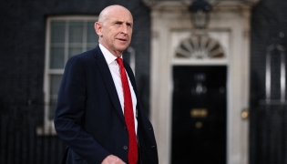 Britain's former Defence secretary John Healey leaves 10 Downing Street in London July 20, 2026 as cabinet appointments are being made after Andy Burnham became Britain's new Prime Minister. (Photo by Henry Nicholls / AFP)