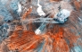 A large walking excavator works in a quarry for the extraction of rare metals. 