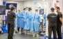 Surgeons and physicians work during the training programme.