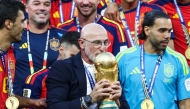 Spain's head coach Luis de la Fuente kisses the trophy after winning the 2026 World Cup football tournament final match between Spain and Argentina at the New York/New Jersey Stadium in East Rutherford on July 19, 2026. (Photo by Franck Fife / AFP)
