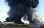 Smoke rises above a warehouse in Saint Petersburg on July 24, 2026, amid the ongoing Russian-Ukrainian conflict. (Photo by AFP)