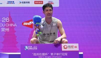Taiwan's Chou Tien-chen poses on the podium at China Open badminton tournament in Changzhou, eastern China's Jiangsu province on July 26, 2026. (Photo by CN-STR / AFP)