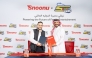 Snoonu and Spacetoon Go officials during the signing of the agreement. 