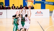 Qatar's Tameem Ashraf Abuissa (right) prepares to shoot.