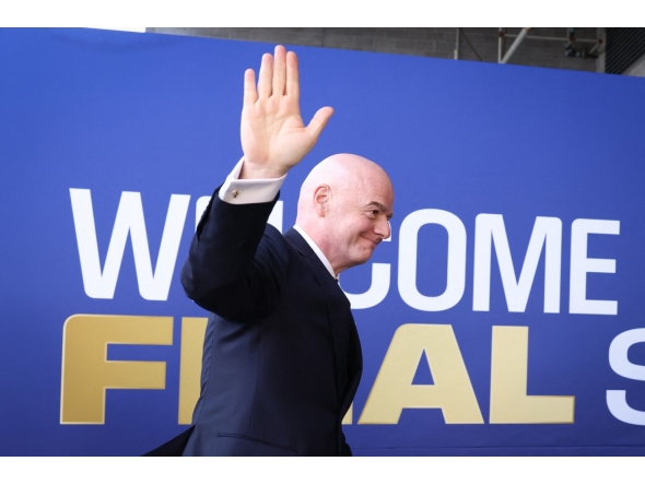FIFA President Gianni Infantino waves as he arrives for the 2026 World Cup football tournament final match in East Rutherford on July 19, 2026. (Photo by Charly Triballeau / AFP)
