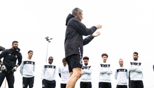 Al Sadd's coach Razvan Lucescu with players during a training session yesterday.