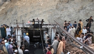 Coal miners and relatives gather at the entrance of a coal mine after it collapsed in the Surange area, some 50 kilometres east of Quetta, on July 30, 2026. (Photo by Banaras Khan / AFP)