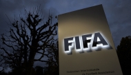 This photo taken on October 8, 2015 in Zurich shows the entrance sign with the logo at the FIFA world headquarters. Photo by Fabrice COFFRINI / AFP
