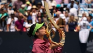 Alexandra Eala of the Philippines kisses the Championship Trophy after winning the women's singles championship match against Jessica Pegula of the United States on the final day of the Washington Open 2026 at William H.G. FitzGerald Tennis Center on August 3, 2026 in Washington, DC. (Photo by Scott Taetsch / GETTY IMAGES NORTH AMERICA / Getty Images via AFP)