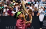 Alexandra Eala of the Philippines kisses the Championship Trophy after winning the women's singles championship match against Jessica Pegula of the United States on the final day of the Washington Open 2026 at William H.G. FitzGerald Tennis Center on August 3, 2026 in Washington, DC. (Photo by Scott Taetsch / GETTY IMAGES NORTH AMERICA / Getty Images via AFP)