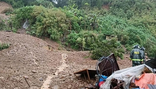 Rescuers work at a landslide site which hit a small restaurant burying three employees who had been in the kitchen, at a village in La Trinidad, Benguet province on August 6, 2026. Photo by AFP