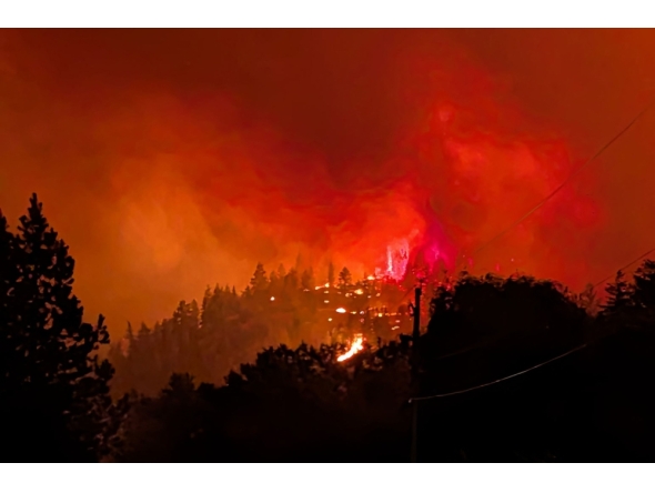 FILE PHOTO: This handout photo taken on August 7, 2026, and released on August 8 by the BC Wildlife Service shows the Bald Range wildfire near Summerland in Canada's western British Columbia province.(Photo by Handout / BC Wildfire Service / AFP) / 