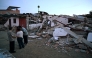 People gather in front of a destroyed house after an earthquake in Colombia on August 11, 2026. AFP file photo.