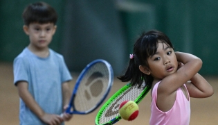 This photo taken on August 7, 2026, shows children taking part in a training session at Alabang Tennis Academy in Muntinlupa, Metro Manila. Photo by JAM STA ROSA / AFP
