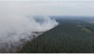 This aerial photograph shows a wildfire burning in the Hautes Fagnes (High Fens) nature reserve in Waimes on August 15, 2026. (Photo by Dimitri KORCZAK / AFP)