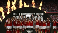 Arsenal's Norwegian midfielder #08 Martin Odegaard lifts the trophy as Arsenal's players celebrate their victory after the English FA Community Shield football match between Arsenal and Manchester City at The Principality Stadium, in Cardiff, south Wales on August 16, 2026. Arsenal won the game 3-0. (Photo by Glyn KIRK / AFP)
