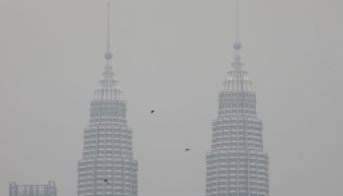 Petronas twin towers shrouded by haze in Kuala Lumpur. Reuters file photo.