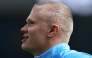 Manchester City's Norwegian striker #09 Erling Haaland, sporting a new hair cut, warms up ahead of the English Premier League football match between Manchester City and AFC Bournemouth at the Etihad Stadium in Manchester, north west England, on August 23, 2026. (Photo by Darren Staples / AFP) 