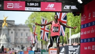 Kenya's Sabastian Sawe crosses the line to win the men's race in a new world record time at the 2026 London Marathon in central London on April 26, 2026. Photo by JUSTIN TALLIS / AFP