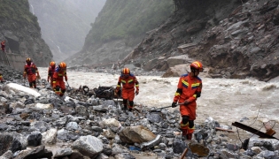 Fire and rescue personnel conduct search and rescue operations 2 kilometers from Gyirong Port days after the August 26 mudslide which destroyed the port, in Gyirong County, in China western Tibet region on August 29, 2026. (Photo by CNS / AFP) 