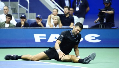 Serbia's Novak Djokovic reacts against Argentina's Mariano Navone during the men's singles first round tennis match on day one of the US Open tennis tournament at the USTA Billie Jean King National Tennis Center in New York City on August 30, 2026. (Photo by CHARLY TRIBALLEAU / AFP)