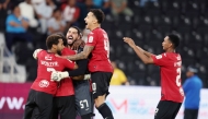 Al Rayyan players celebrate their win over Al Shamal.