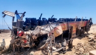 The wreckage of a passenger bus that overturned on the Dahab-Nuweiba road is pictured at the site of the crash in Egypt's South Sinai province on September 2, 2026. (Photo by AFP)