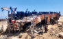 The wreckage of a passenger bus that overturned on the Dahab-Nuweiba road is pictured at the site of the crash in Egypt's South Sinai province on September 2, 2026. (Photo by AFP)