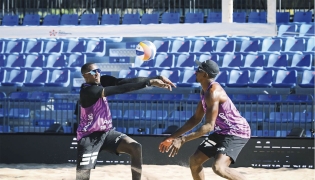 Qatar’s Cherif Younousse (left) and Ahmed Tijan in action during their match yesterday. 