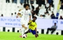 Al Sadd's Akram Afif (left) controls the ball.