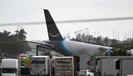 The tail section of a cargo plane is seen at Miami International Airport after it overran the runway at Miami International Airport in Miami, Florida, on September 6, 2026. (Photo by CHANDAN KHANNA / AFP)