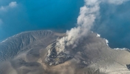This handout aerial picture taken on September 6, 2026 and released on September 7, 2026 by the Indonesia's Center for Volcanology and Geological Hazard Mitigation shows the Mount Krakatau (Krakatoa) in the Sunda Strait, in South Lampung, Lampung province, spewing smoke and volcanic ash during an eruption. (Photo by Handout / Indonesia's Center for Volcanology and Geological Hazard Mitigation / AFP)