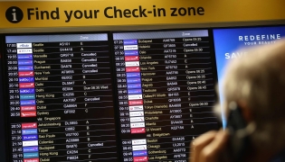 Cancelled flights are pictured on an electronic check-in display board at Terminal 3 of London Heathrow airport, west of London on September 8, 2026, following major disruption due an issue affecting the NATS air traffic control systems. Photo by Henry NICHOLLS / AFP