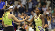 Kazakhstan's Elena Rybakina goes in to hug USA's Coco Gauff after their women's singles semi-final tennis match on day twelve of the US Open tennis tournament at the USTA Billie Jean King National Tennis Center in New York City on September 10, 2026. (Photo by KENA BETANCUR / AFP)