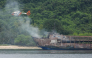 This handout photo taken on September 11, 2026 and released by the Philippine Coast Guard (PCG) shows a coast guard helicopter flying over the M/V June Aster ferry off the shore in Coron, Palawan province. (Photo by Handout / Philippine Coast Guard (PCG) / AFP)