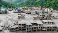 (Files) An aerial view shows houses lying deluged in sludge after flash floods at Devighat, Bidur Municipality in Nepal's Nuwakot district on August 27, 2026. (Photo by Prabin Ranabhat / AFP)