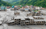 (Files) An aerial view shows houses lying deluged in sludge after flash floods at Devighat, Bidur Municipality in Nepal's Nuwakot district on August 27, 2026. (Photo by Prabin Ranabhat / AFP)