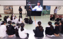 Ibtihaj Muhammad speaking to the young athletes during the Qatar Foundation’s Touché: International Fencing Day event at Education City.