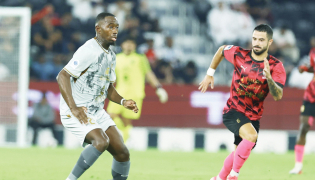 Al Duhail's Boubakary Soumare (left) controls the ball.