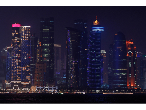 The skyline of illuminated high-rise buildings is seen along the Corniche Promenade in Doha on September 4, 2026. (Photo by Karim Jaafar / AFP)
