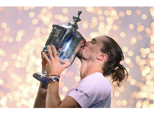 Germany's Alexander Zverev kisses the trophy after defeating USA's Ben Shelton in the men's singles final tennis match on day fifteen of the US Open tennis tournament at the USTA Billie Jean King National Tennis Center in New York on September 13, 2026. (Photo by ANGELA WEISS / AFP)