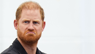 Britain's Prince Harry, Duke of Sussex reacts during a panel discussion during his visit to Ninestiles School, in Birmingham, central England on September 18, 2026, as part of the launch of the INSPIRE education programme ahead of the Invictus Games in Birmingham in 2027. Photo by Aaron Chown / POOL / AFP