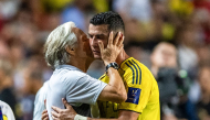 (Files) Al-Nassr's head coach Jorge Jesus (L) embraces Cristiano Ronaldo during the Saudi Super Cup semi-final football match on August 19, 2025. (Photo by Wun Suen / AFP)